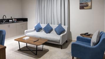 Deluxe Suite, 2 Bedrooms | Living area | Printers