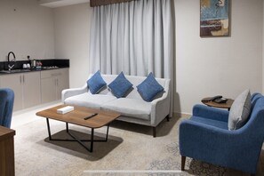 Deluxe Suite, 2 Bedrooms | Living area | Printers