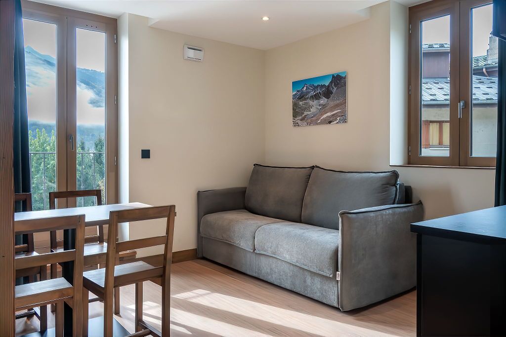 Family Room, Kitchenette | Living area | LED TV, books, first-run movies, heated floors