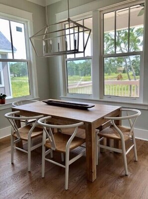 Enjoy meals in this dining area with a rectangular table and four comfortable chairs.