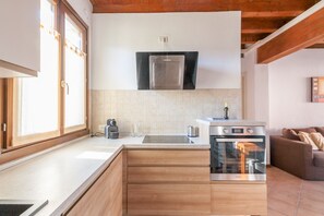 Comfort Condo, 2 Bedrooms, Patio, Garden View | Private kitchen | Full-sized fridge, electric kettle, cookware/dishes/utensils - Lugana Resort & Sporting Club - Sermana Village (Peschiera del Garda)