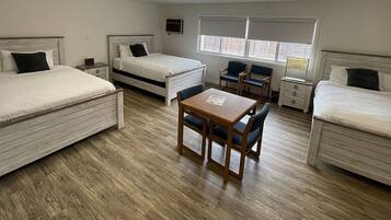 Deluxe Room 3 Queen Beds | Desk, laptop workspace, blackout curtains, iron/ironing board