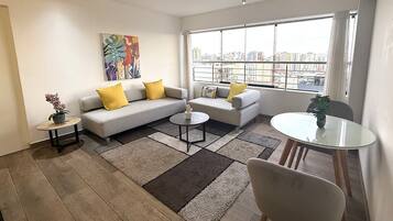 Executive Apartment, 1 Bedroom, Executive Level | Living area | 55-inch Smart TV with cable channels