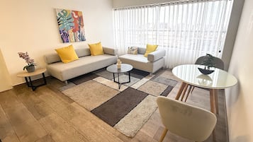 Executive Apartment, 1 Bedroom, Executive Level | Living area | 32-inch Smart TV with cable channels