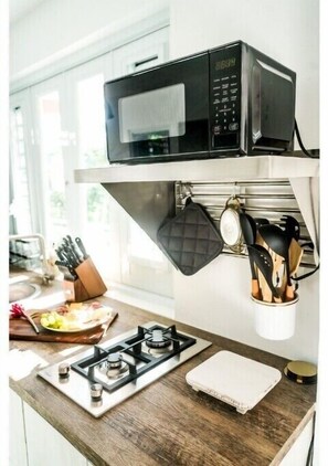 Fridge, microwave, stovetop, coffee/tea maker