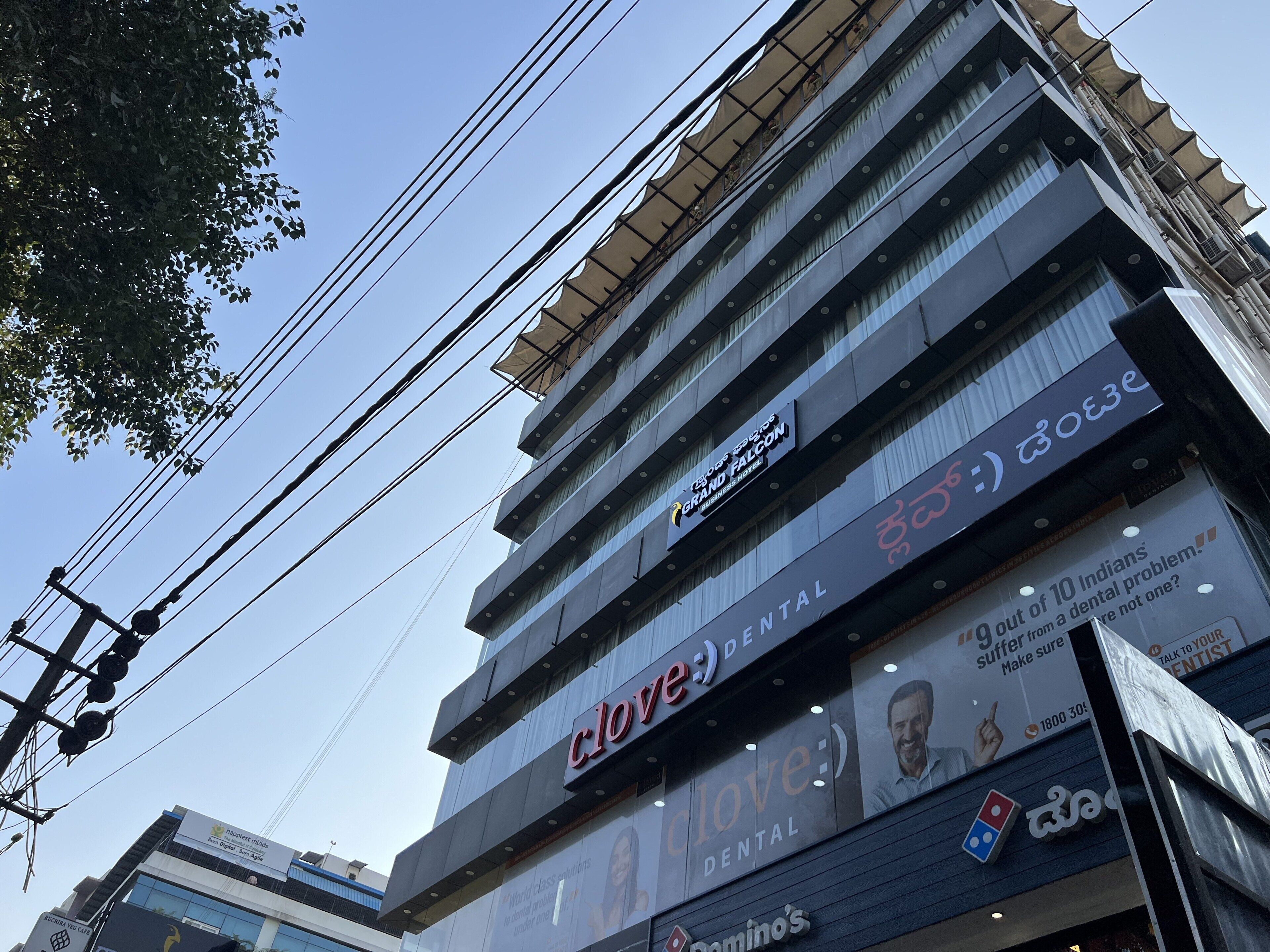 A multi-story building with a dental clinic on the ground floor.