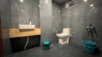 Deluxe Room | Bathroom | Hair dryer, slippers, towels, soap