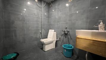 Deluxe Room | Bathroom | Hair dryer, slippers, towels, soap