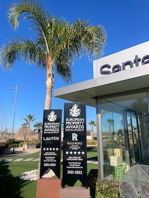 A building with a sign that reads "SANTA ROSALIA LAKE AND LIFE RESORT".