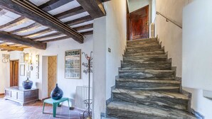 A staircase with marble steps leading to a wooden door. - Vacation Home in Camaiore with 4 bedrooms sleeps 8 (Camaiore)