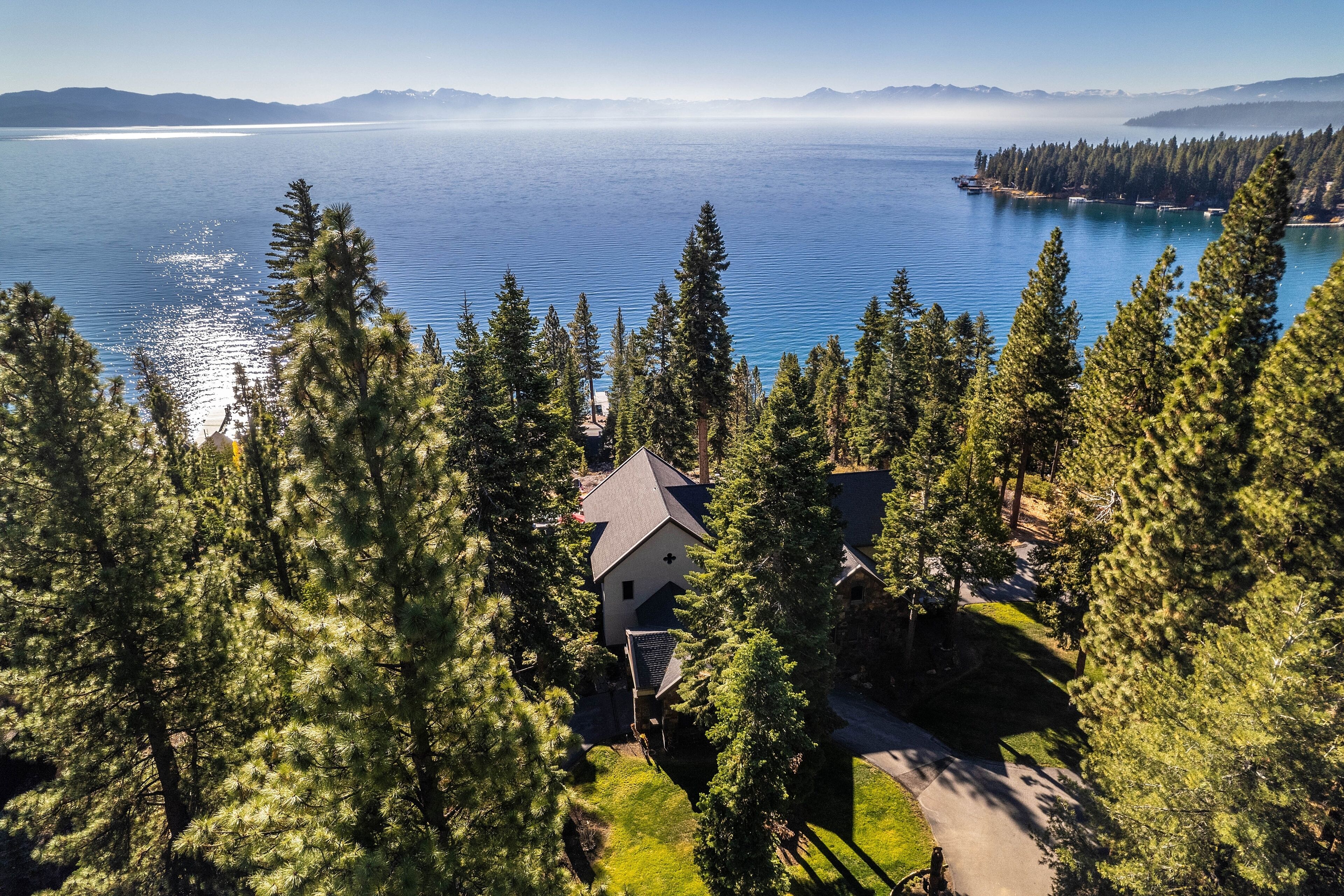 Stunning lakefront villa with hot tub, large patio, firepit & views