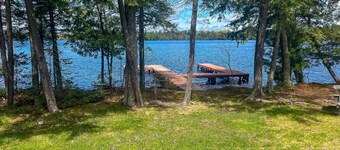 Dog-friendly lakefront property with dock, boat lift, firepit, & two kitchens
