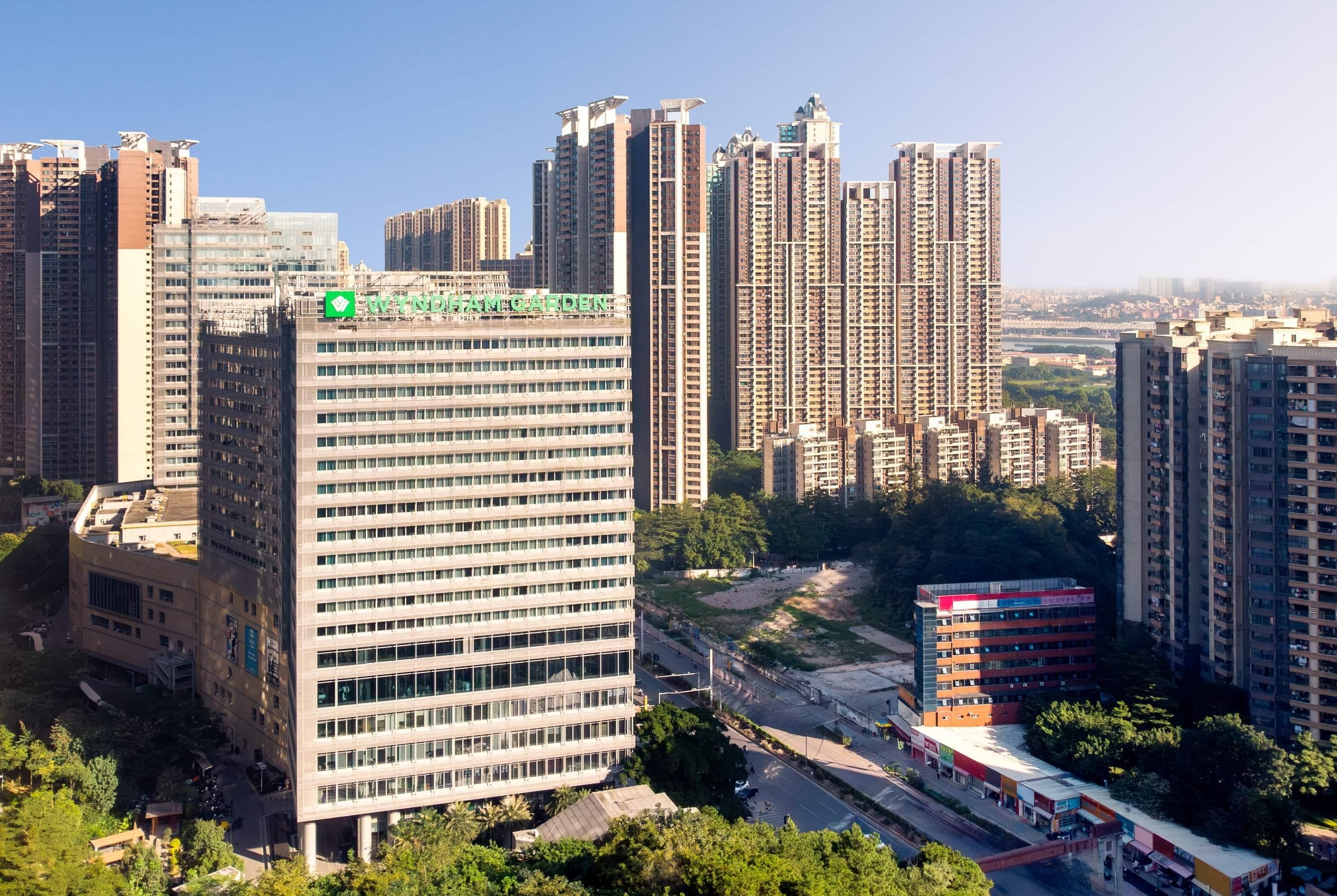 A high-rise building with a prominent sign reading 'WYNDHAM GARDEN'.