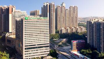 A high-rise building with a prominent sign reading 'WYNDHAM GARDEN'.
