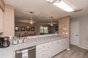Enjoy cooking in this well-equipped kitchen with a central island and coffee maker.