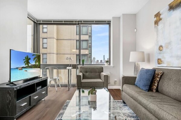 Smart TV, fireplace - Modern 2BR | Business Center | Near PATH by GLS (Jersey City)