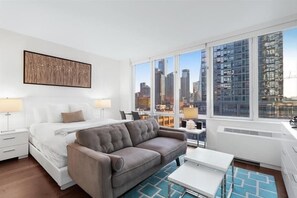 Desk, iron/ironing board, free WiFi, bed sheets - Modern Studio | Washer/Dryer | by GLS (New York)