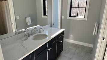 Shower, hair dryer, towels, soap