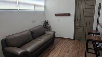 Executive Apartment | Living room | 32-inch Smart TV with digital channels, smart speakers