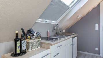 Fridge, microwave, stovetop, coffee/tea maker