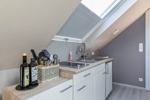 Fridge, microwave, stovetop, coffee/tea maker