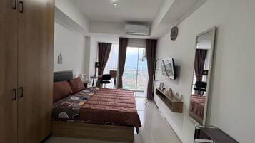 Desk, laptop workspace, bed sheets