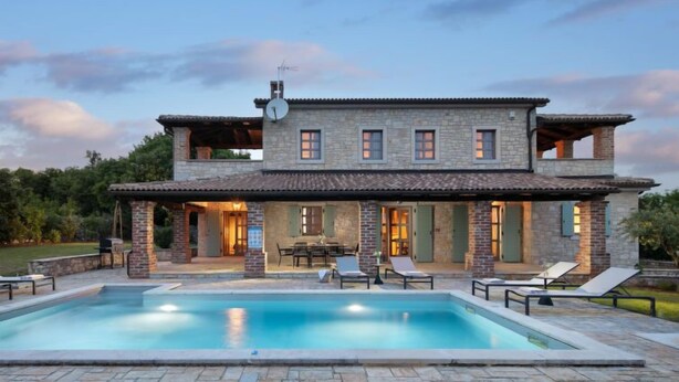 A two-story stone house with a swimming pool, outdoor seating, and a covered patio area. - Calluna by Interhome (Poreč/Sv. Lovreč)