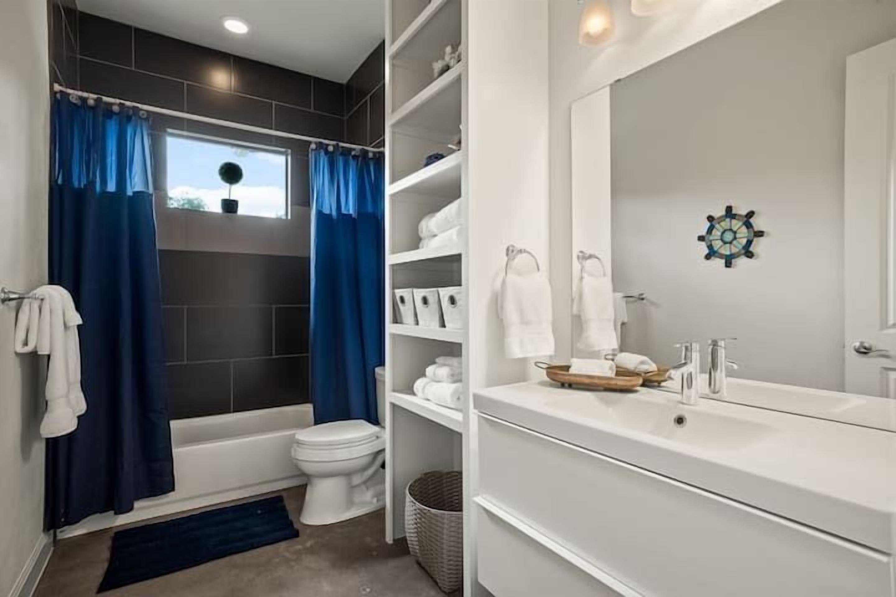 Shower, hair dryer, towels, shampoo