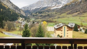 A mountain landscape with a road, buildings, and a clear view of the valley. - Edelweiss A by Interhome (Leukerbad)