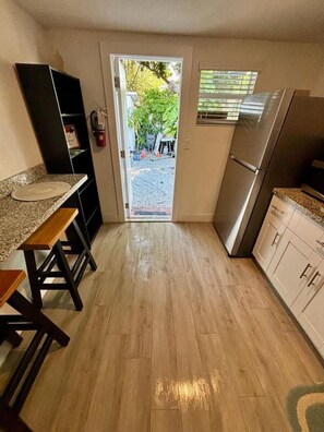 Fridge, microwave, stovetop, coffee/tea maker