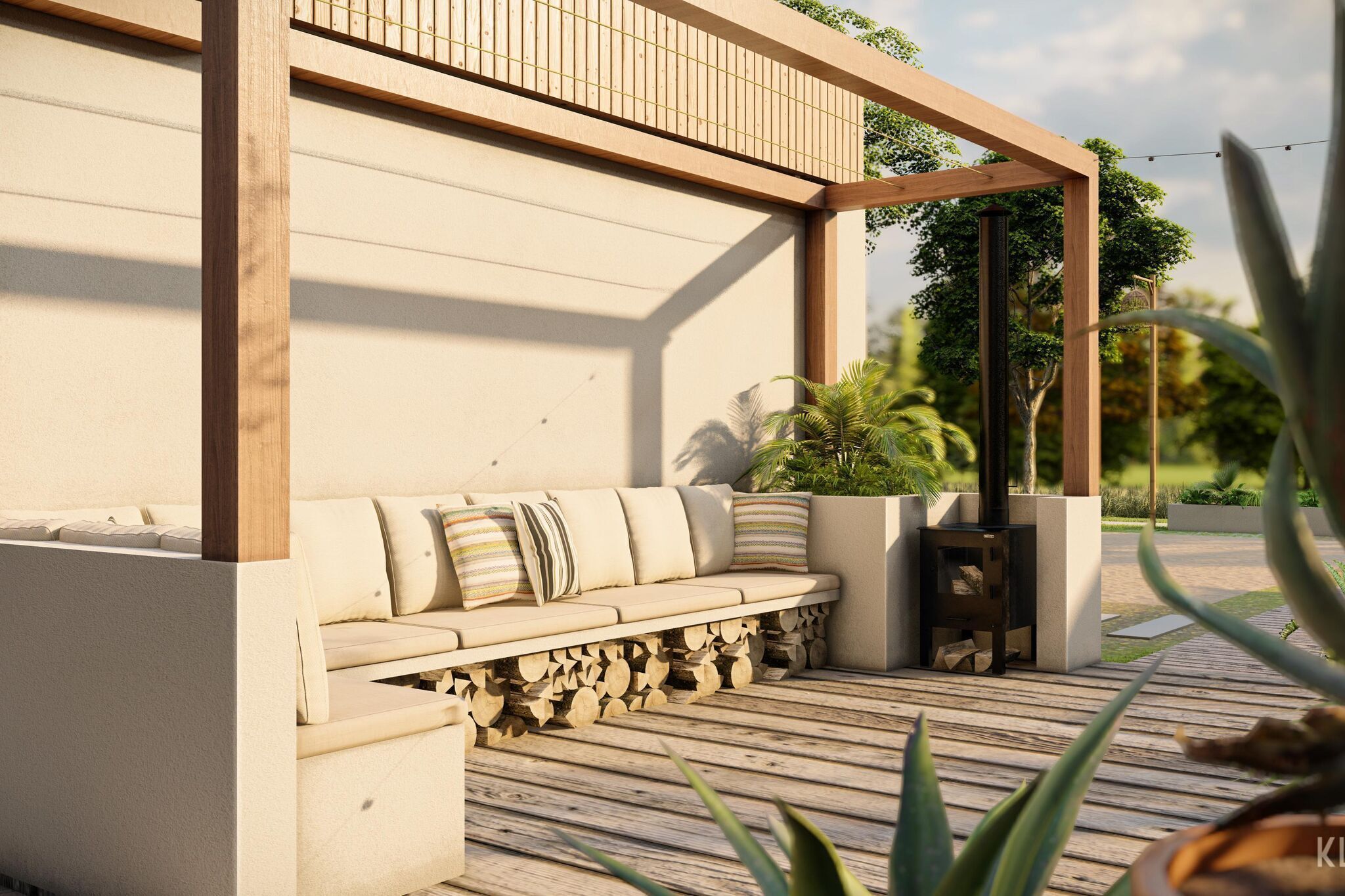A wooden deck with a beige sofa and cushions, a built-in bench, and a small black table with logs.