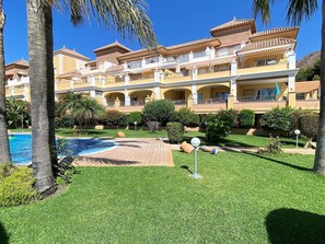 Experience the charm of this traditional hotel, surrounded by lush greenery and a sparkling pool.