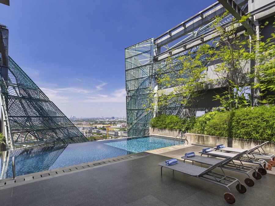 Outdoor pool, open 6:00 AM to 6:00 PM, pool loungers