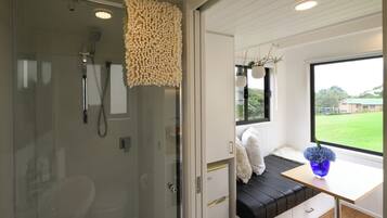 Shower, eco-friendly toiletries, towels, soap
