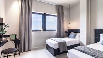 Habitación Confort con 2 camas individuales | Minibar, caja fuerte, wifi gratis y ropa de cama