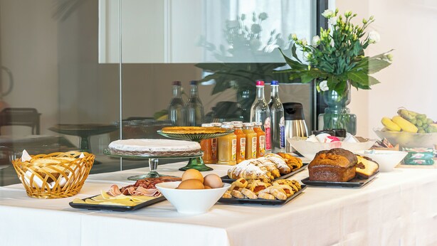 A buffet table with various food items and condiments. - Feudo Antico (Tollo)
