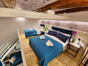1 habitación, tabla de planchar con plancha y cuna de viaje 