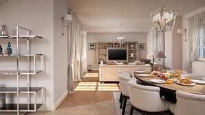 A modern dining area with a round table, chairs, and a TV in the background. - Stunning home in Vabriga (Vabriga)