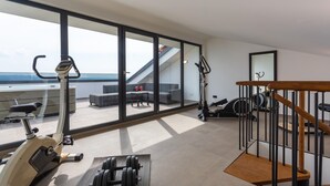A spacious room with a large sliding glass door leading to a balcony with outdoor furniture. - Lovely home in Crikvenica (Crikvenica)