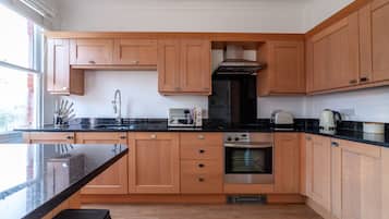 Apartment | Private kitchen | Full-size fridge, microwave, oven, stovetop