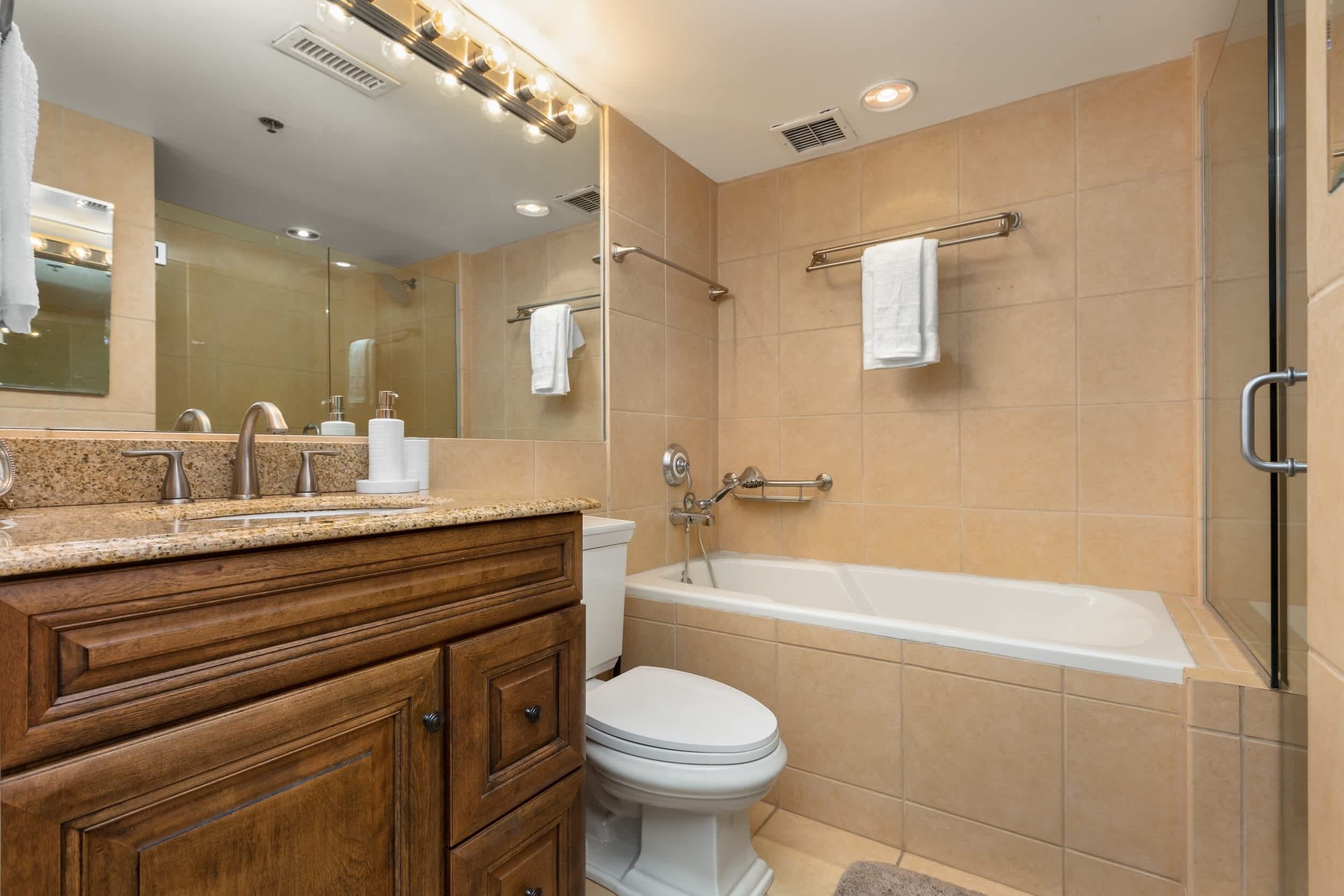 Shower, hair dryer, towels, shampoo