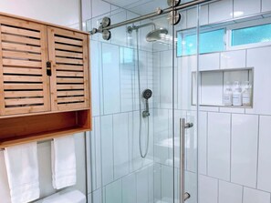 Shower, hair dryer, towels, shampoo
