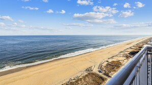 A beach with a clear view of the ocean and a sandy shoreline. - Direct Oceanfront 3-bedroom 3 bath condo with direct beach access, fitness room, indoor and outdoor pool (Ocean City)