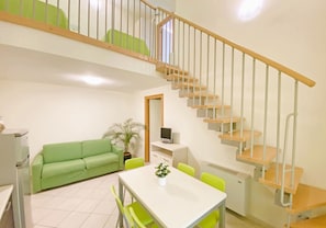 Apartment | Living area | 24-inch flat-screen TV with satellite channels, table tennis - Residence just 600 meters from the beach (Rosignano Marittimo)