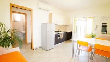 Apartment | Living area | 24-inch flat-screen TV with satellite channels, table tennis