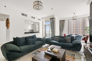 Living area - WelHome - 3BR Apt Located Directly on the Dubai Water Canal (Dubai)