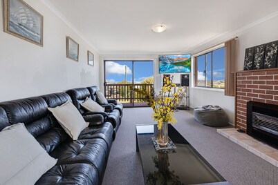 Harmony: Perched on a slope, this retreat offers views of the ocean