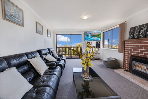 Harmony - Perched on a slope, this retreat offers views of the ocean