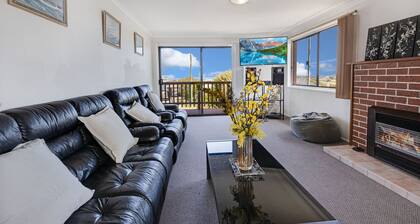 Harmony - Perched on a slope, this retreat offers views of the ocean