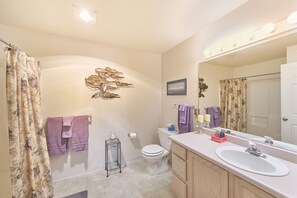 A bathroom with a toilet, sink, and shower area. - Amazing Ocean View, In Town, Walk to Beach (Top) (Long Beach)
